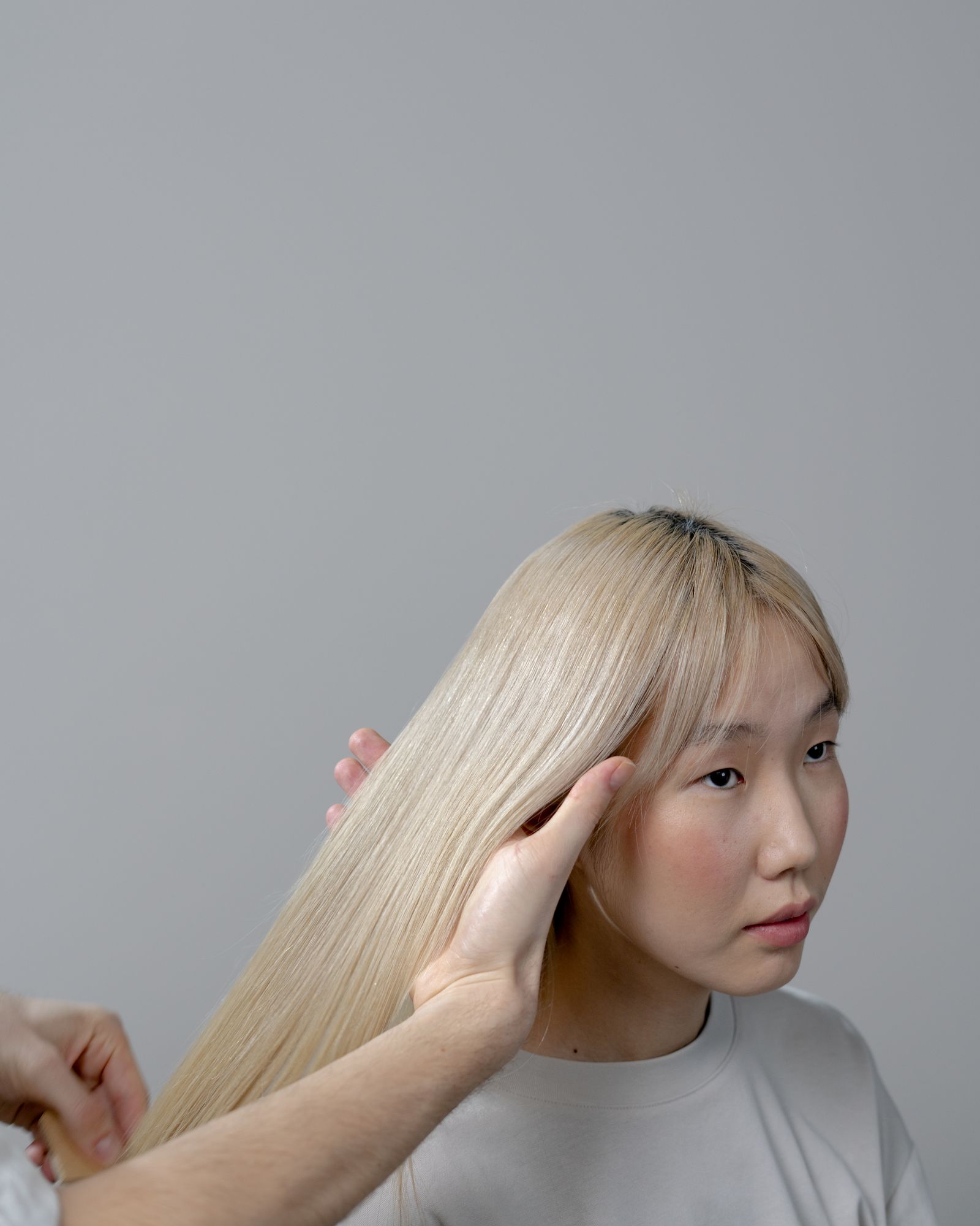 Smooth blonde balayage hair, studio shot